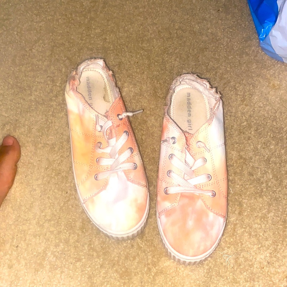 Pink and white tennis shoes